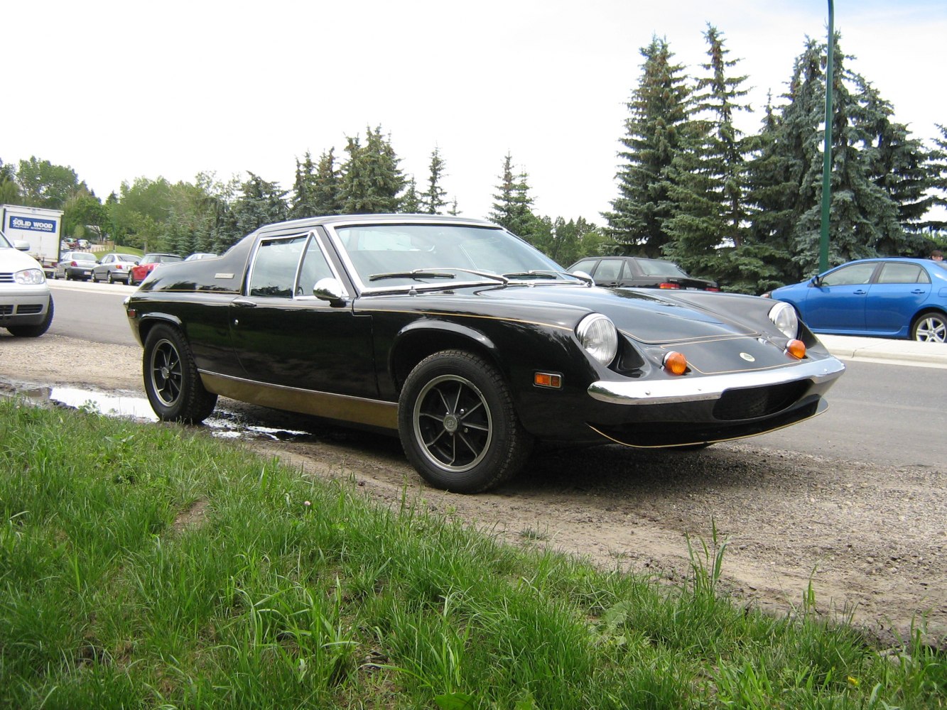 https://totalrenting.es/wp-content/uploads/2022/10/lotus-europa-1971-1-6-106-cv-coupe-2.png