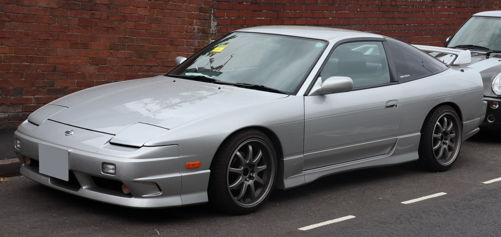 https://totalrenting.es/wp-content/uploads/2022/10/nissan-180-sx-1989-1-8-turbo-169-cv-coupe.png