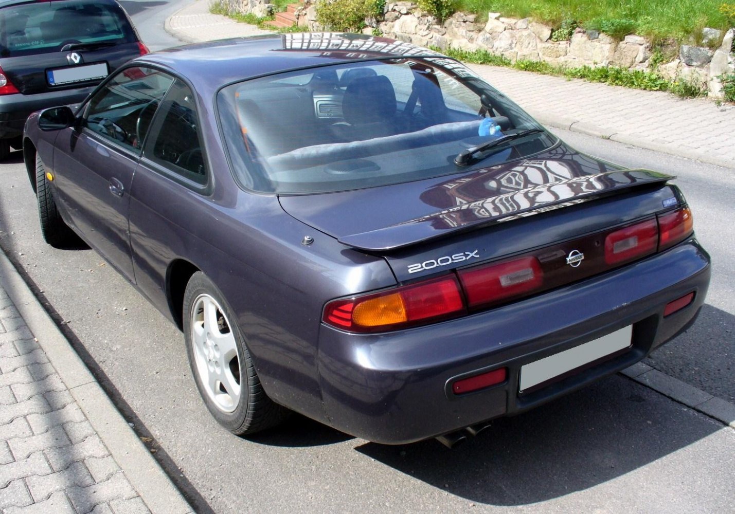 https://totalrenting.es/wp-content/uploads/2022/10/nissan-200-sx-s14-1993-2-0-i-16v-turbo-200-cv-coupe-1.png