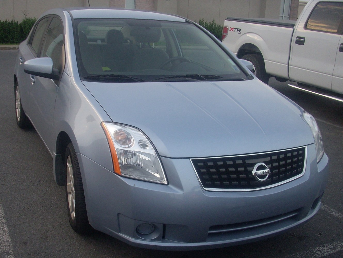 https://totalrenting.es/wp-content/uploads/2022/10/nissan-sentra-vi-2007-2-0i-16v-135-cv-berlina-4.png