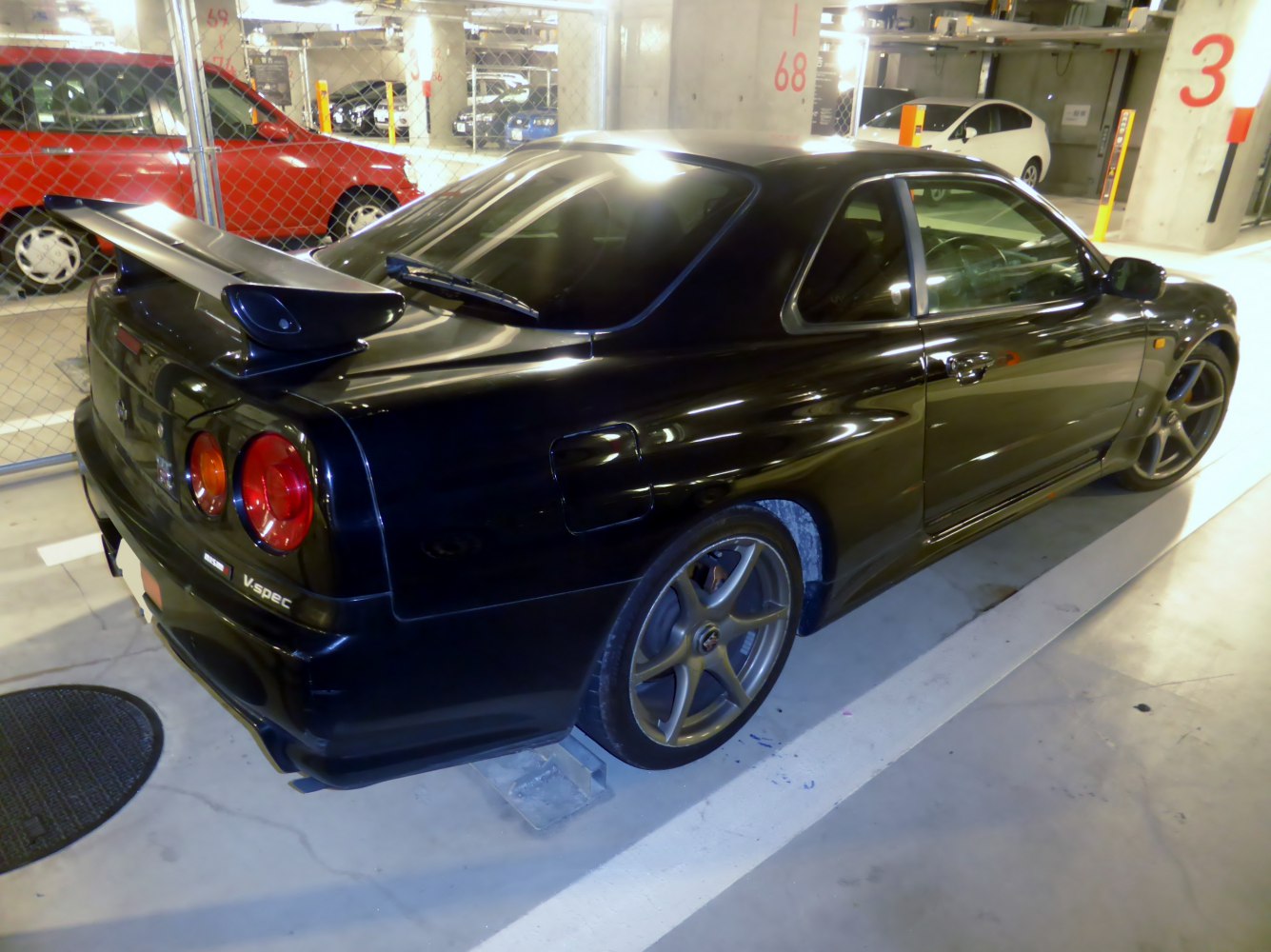 https://totalrenting.es/wp-content/uploads/2022/10/nissan-skyline-gt-r-x-r34-1998-2-6-i-24v-turbo-4wd-280-cv-coupe-1.png