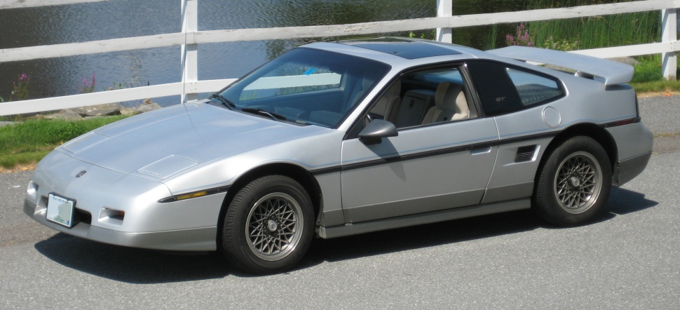 https://totalrenting.es/wp-content/uploads/2022/10/pontiac-fiero-1984-sport-2-5-93-cv-coupe.png